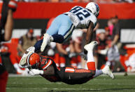 <p>Cleveland Browns strong safety Derrick Kindred (26) tackles Tennessee Titans tight end Jonnu Smith (81) in the second half of an NFL football game, Sunday, Oct. 22, 2017, in Cleveland. (AP Photo/Ron Schwane) </p>