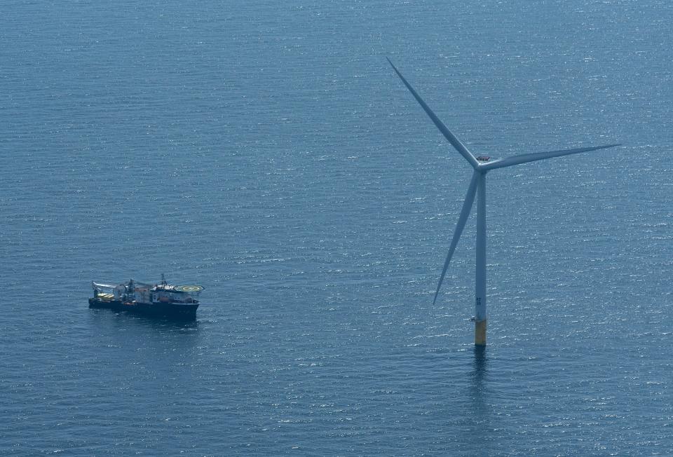 The offshore supply boat Cade Candies sits off one of the Vineyard Wind 1 turbines 12 miles south of Martha's Vineyard on April 29. When installation is completed, there will be an array of 62 wind turbines.