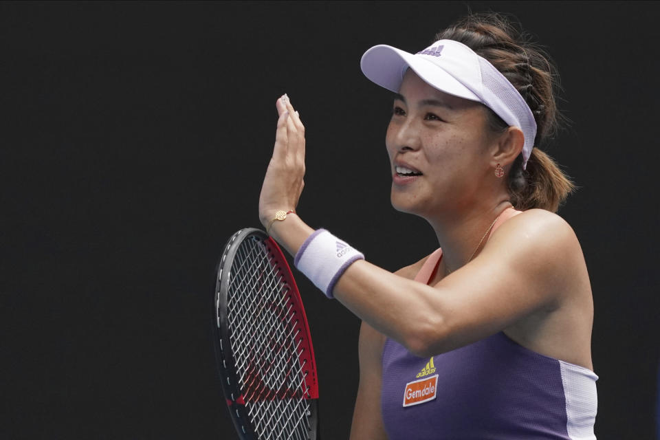 China's Wang Qiang celebrates after defeating Serena Williams of the U.S. in their third round singles match at the Australian Open tennis championship in Melbourne, Australia, Friday, Jan. 24, 2020. (AP Photo/Lee Jin-man)