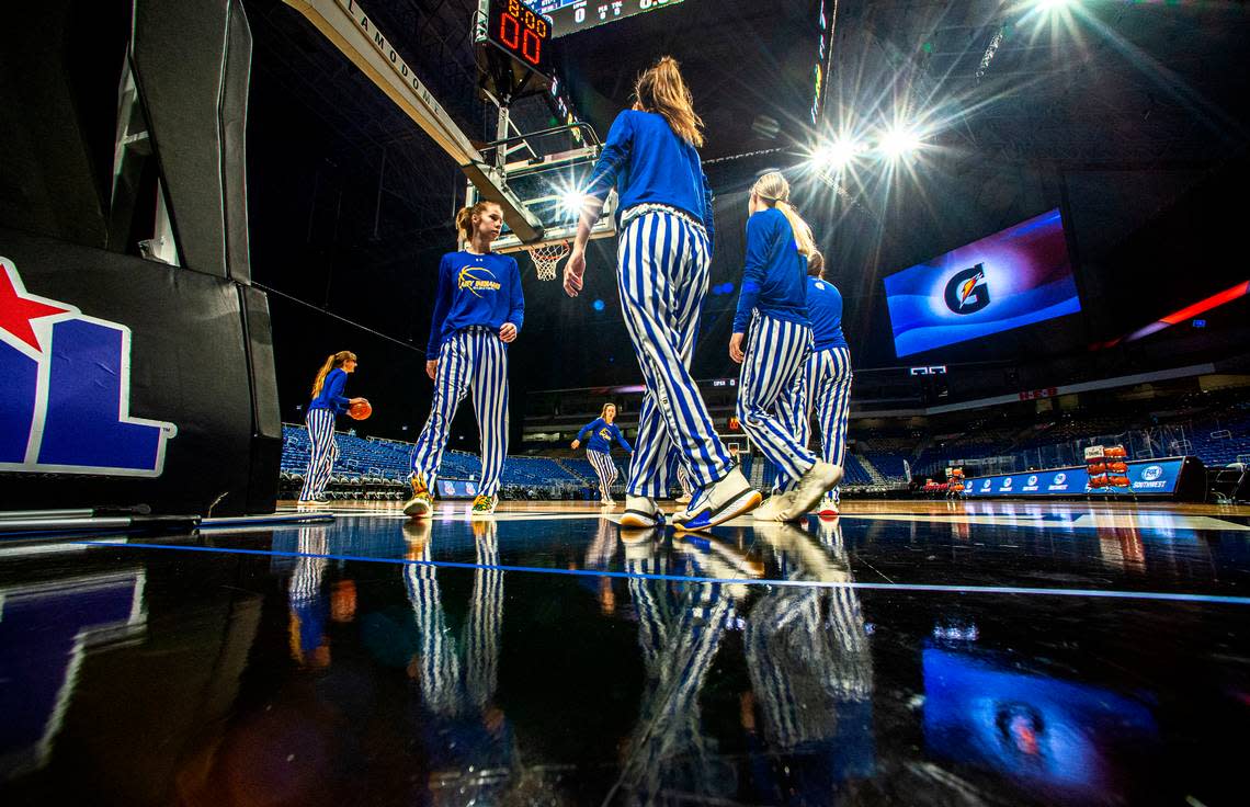 The Lipan Lady Indians are no strangers to the Texas state basketball tournaments, having made it nine times. Lipan forward Chelsea Lott, second from left, warming up under the bright lights of the Alamodome in 2021 when they won their first Class 2A title.