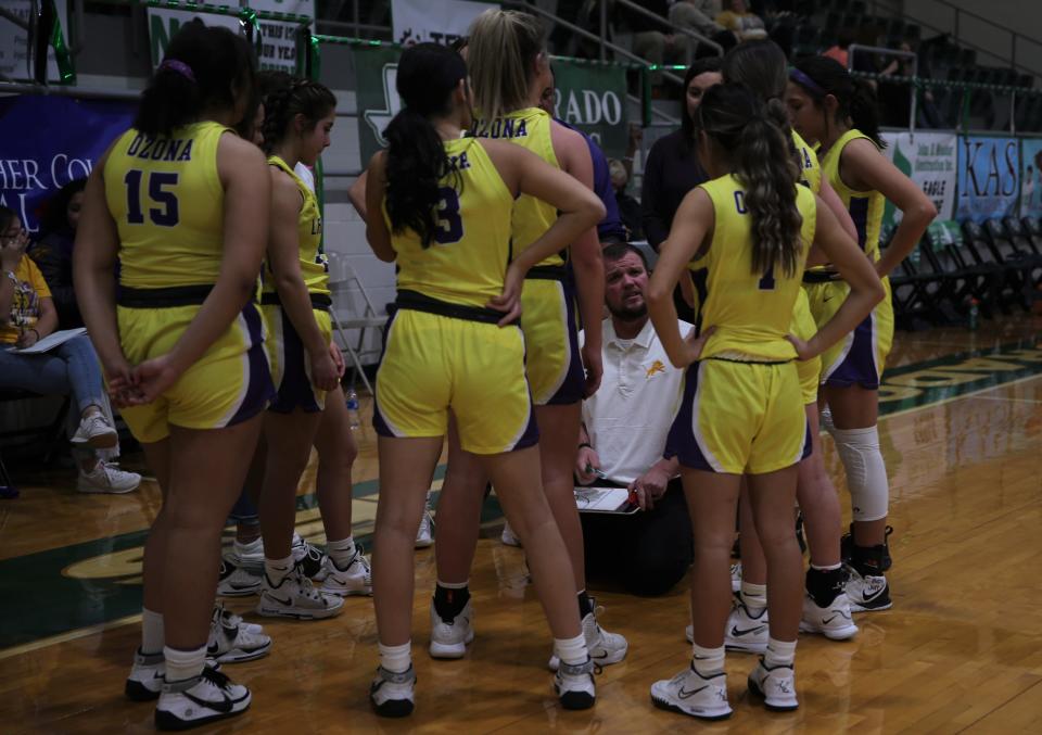 Ozona High School head coach Chad Myers talks things over with his team during a time out in the fourth quarter of a District 7-2A girls basketball game against Eldorado, Tuesday, Jan. 25, 2022, in Eldorado.