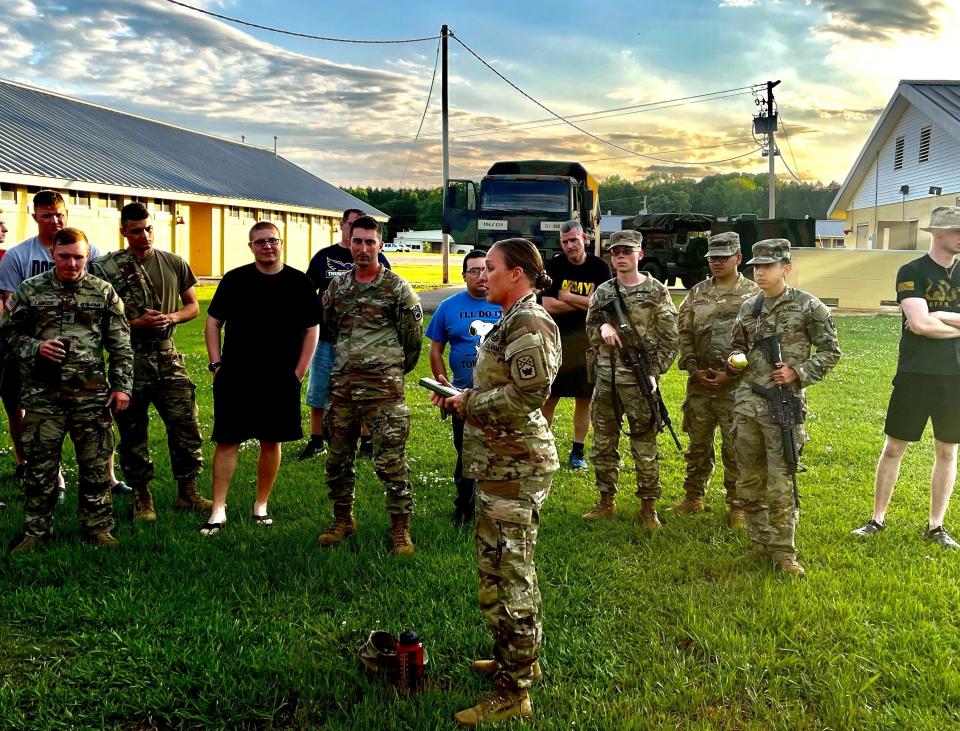 Soldiers from the Tennessee National Guard's 267th Military Police Company listen to 1st Sgt. Leigh Ann Hester. The unit left Sunday, May 21, 2023 on the first leg of a year-long deployment overseas to the Middle East.