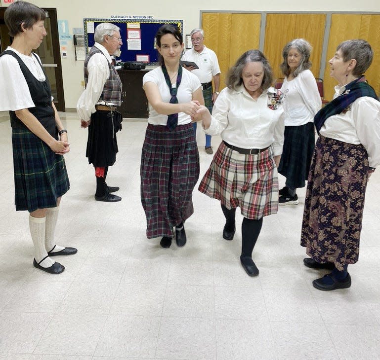 People participate in Scottish country dance lessons in October at First Presbyterian Church in Bloomington.