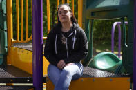 Erica Lafferty, whose mother Dawn Lafferty Hochsprung was killed during the Sandy Hook Elementary School shooting in 2012, poses for a picture on the playground honoring her mother in Watertown, Conn., Wednesday, May 25, 2022. In the decade since 20 children and six educators were killed at Sandy Hook Elementary, some of their loved ones who channeled grief into advocacy have claimed success, gradually, in areas including gun safety, attitudes around gun violence, and mental health awareness. (AP Photo/Seth Wenig)