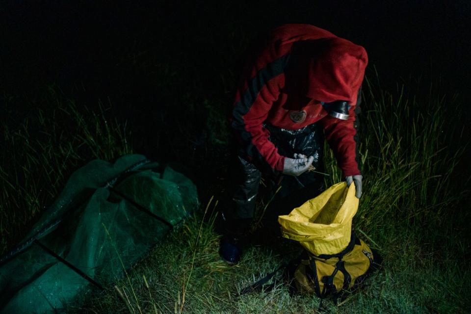 A man looks into a bag