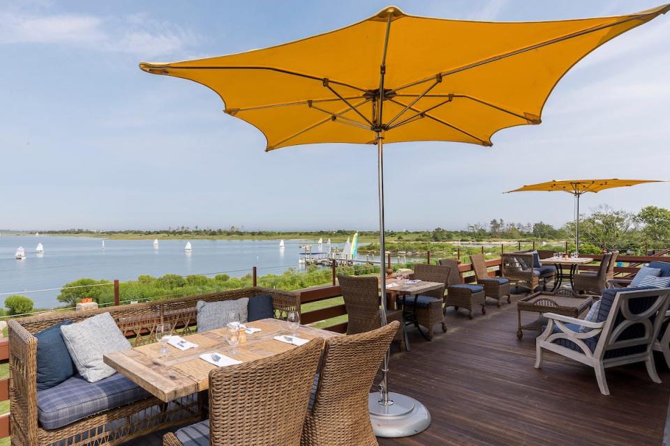 The deck at the Weekapaug Inn offers a great view of Quonochontaug Pond and the Atlantic Ocean just beyond.