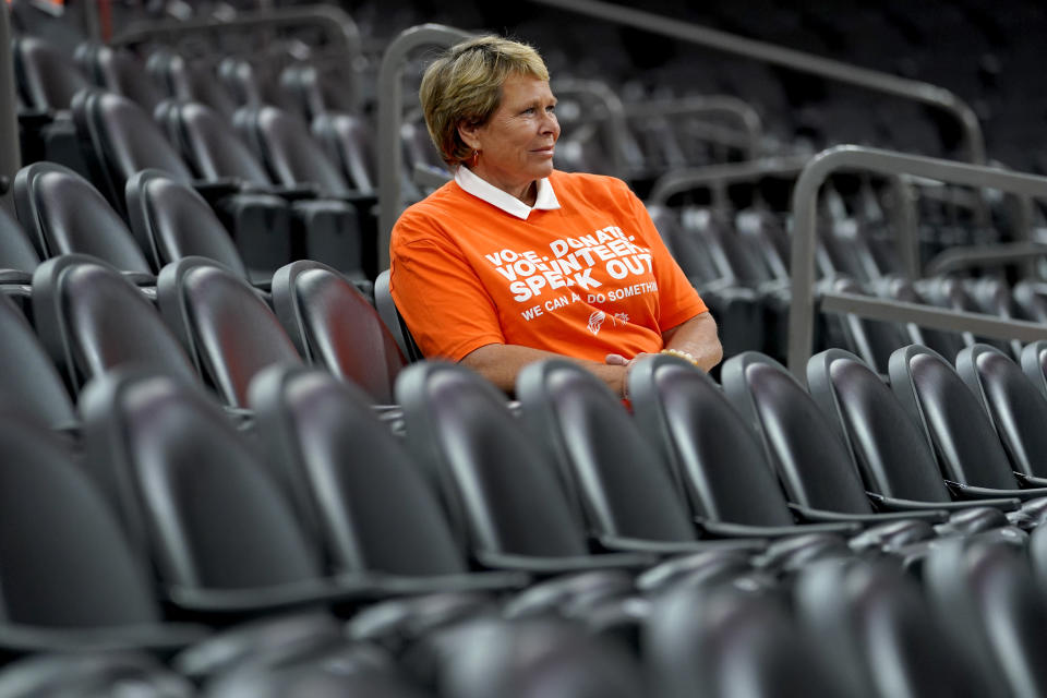 Ann Meyers Drysdale prepares her court-side broadcast prior to a Phoenix Mercury basketball game, Friday, June 3, 2022 in Phoenix. Ann Meyers Drysdale was the first woman to receive an athletic scholarship at UCLA. The Hall of Famer, longtime TV basketball analyst and mother of three shares how Title IX has shaped her life and career in a story for The Associated Press, and what needs to be done over the next 50 years for the law to continue to have a positive impact on young girls and women.(AP Photo/Matt York)