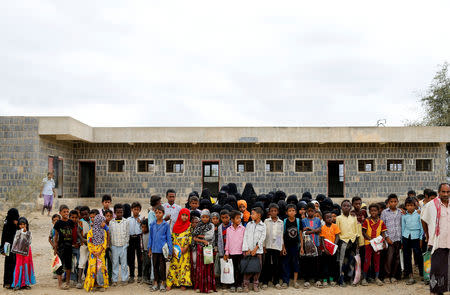 Students gather outside a school where Afaf Hussein, 10, who is malnourished, used to study near her home village of al-Jaraib in northwestern province of Hajjah, Yemen, February 19, 2019. Afaf, who now weighs around 11 kg and is described by her doctor as "skin and bones", has been left acutely malnourished by a limited diet during her growing years and suffering from hepatitis, likely caused by infected water. She left school two years ago because she got too weak. REUTERS/Khaled Abdullah