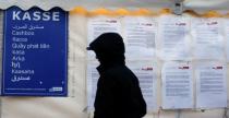 A migrant enters a tent that serves as a waiting room at the the Berlin Office of Health and Social Affairs (LAGESO), in Berlin, Germany, January 5, 2016. REUTERS/Hannibal Hanschke