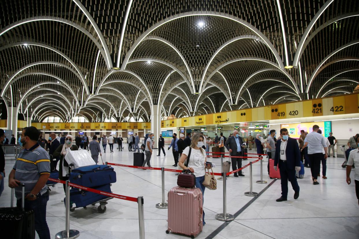 Passengers prepare to travel at an airport in Baghdad, Iraq on July 23, 2020. Iraq opened its airports to commercial flights on Thursday following months of lockdown as part of the government's plan to ease restrictions.