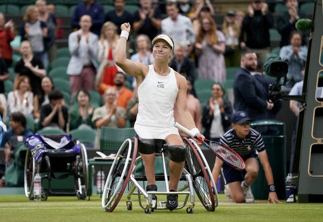 Diede de Groot raises her fist in celebration