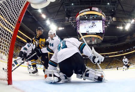 San Jose Sharks goalie Martin Jones (31) makes a save as defenseman Marc-Edouard Vlasic (44) defends against Pittsburgh Penguins left wing Carl Hagelin (62) in the second period of game one of the 2016 Stanley Cup Final at Consol Energy Center. Mandatory Credit: Bruce Bennett/Pool Photo via USA TODAY Sports