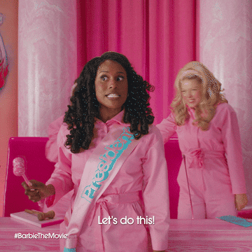 Two people in pink outfits with the text "Let's do this!" from #BarbieTheMovie