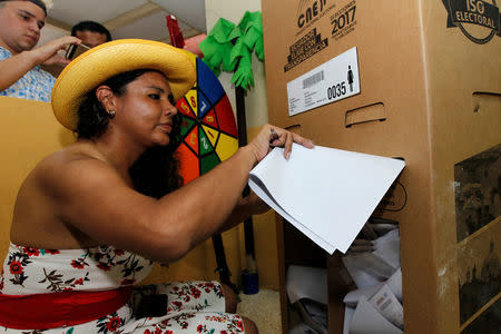 Diane Rodriguez, a member of the Ecuadorean transgender community, casts her vote during the presidential election in Guayaquil, Ecuador February 19, 2017. REUTERS/Guillermo Granja