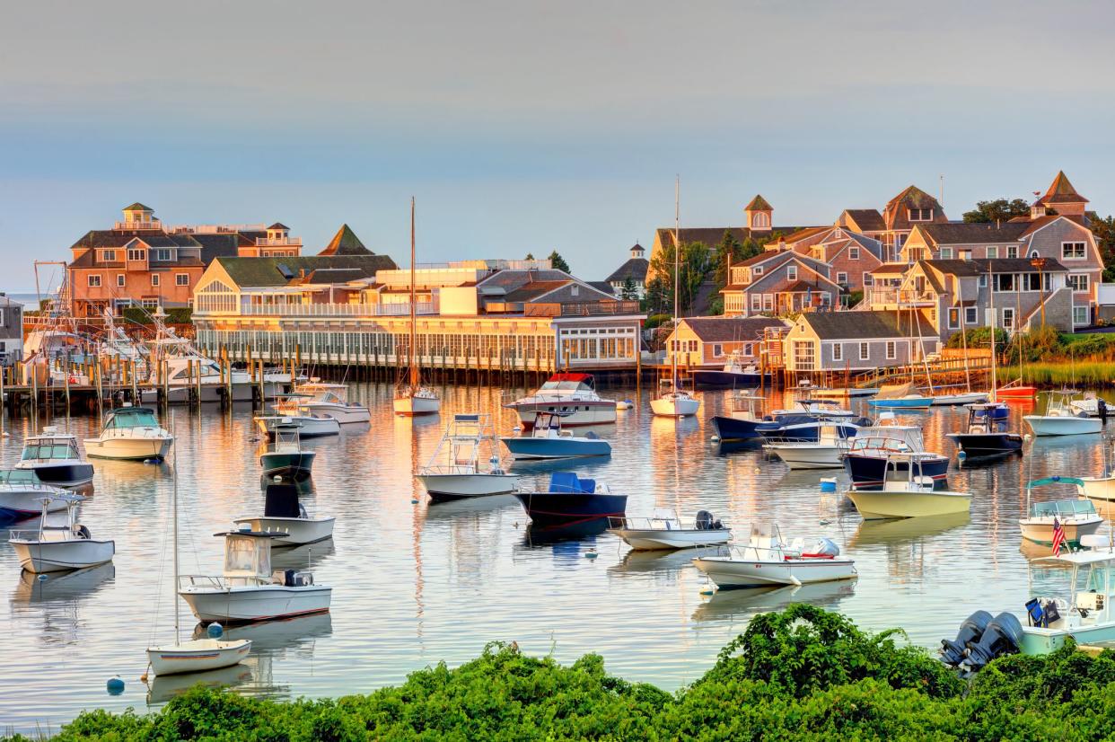 Numerous boats in Wychmere Harbor, Harwich on Cape Cod, Massachusetts during sunrise