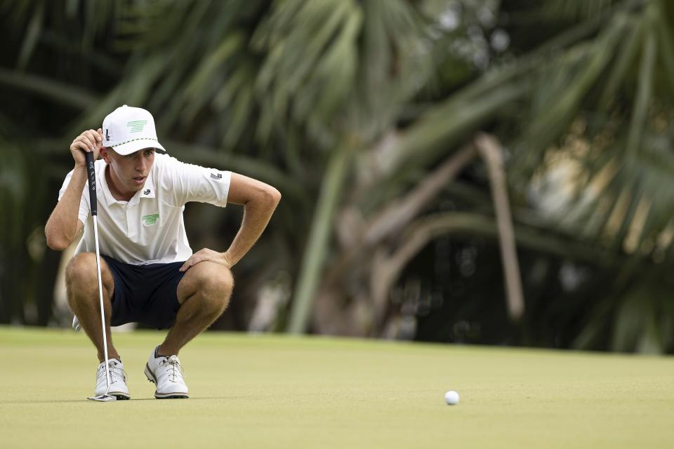 David Puig of Torque GC reads his putt on the seventh green during the first round of LIV Golf Singapore at the Sentosa Golf Club on Friday, April 28, 2023 in Sentosa, Singapore. (Doug DeFelice/LIV Golf via AP)