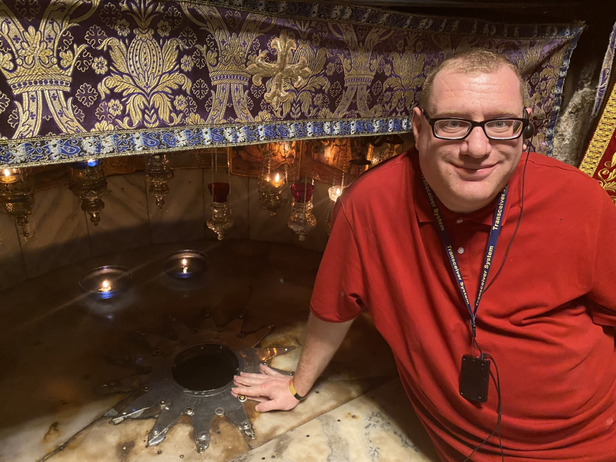 Paul A. Crowley of Waynesburg touches the spot where Jesus was born inside the Church of the Nativity in Bethlehem.