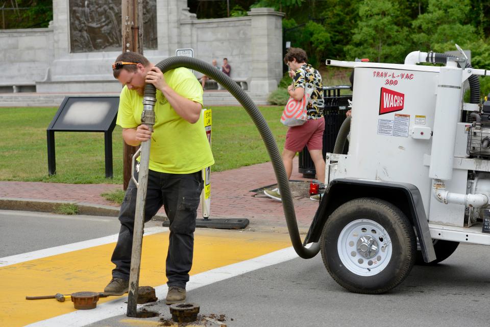 PROVINCETOWN -- 08/11/22 -- A crew from the town's water department uses a Trav-L-Vac used for sewer system valve box cleaning along Bradford Street.