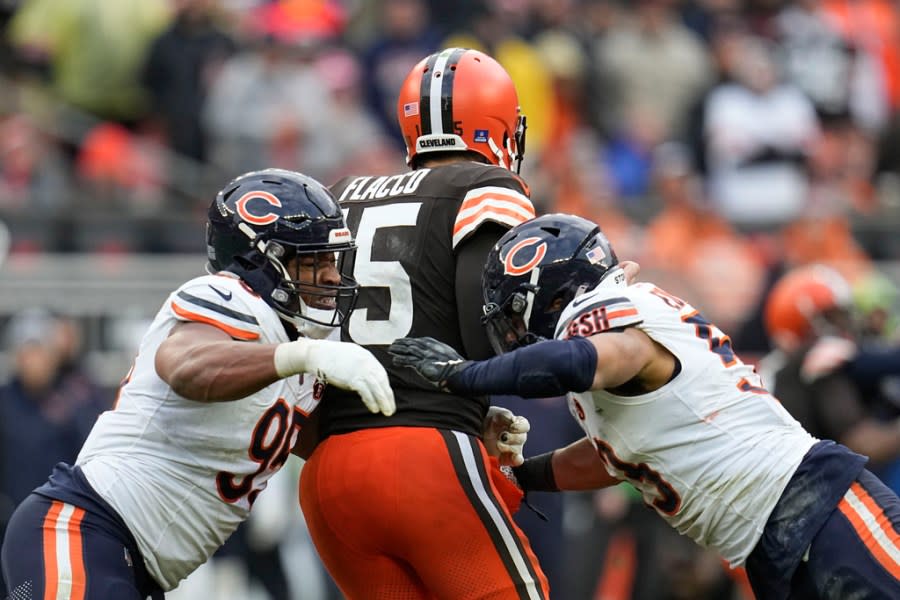 Chicago Bears defensive end DeMarcus Walker (95) sacks Cleveland Browns quarterback Joe Flacco (15) in the second half of an NFL football game in Cleveland, Sunday, Dec. 17, 2023. (AP Photo/Sue Ogrocki)