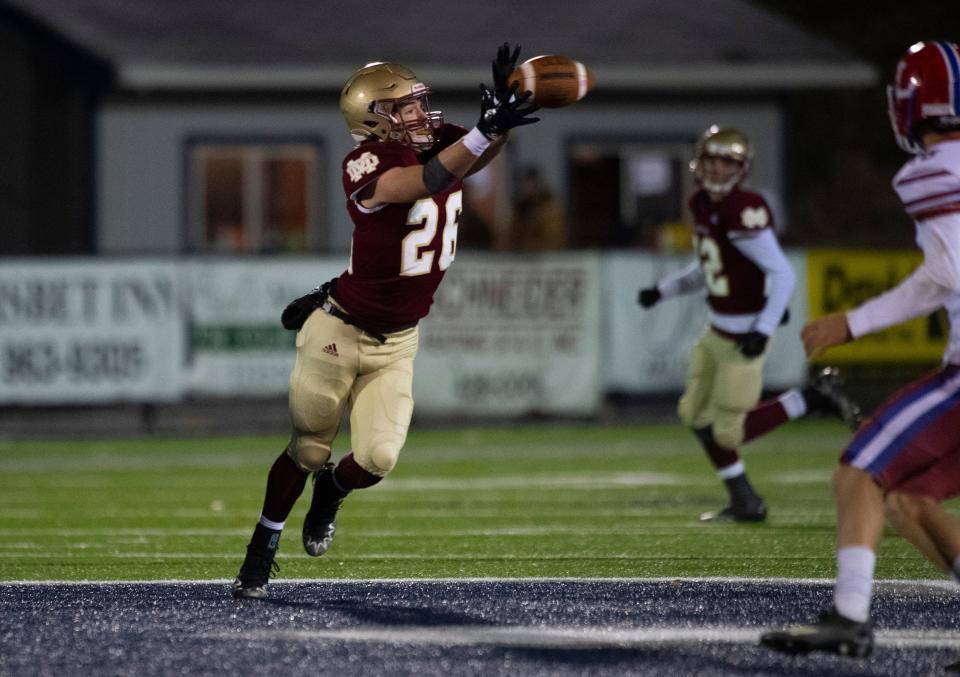 Mater Dei's Spencer Turner (26) reaches for a pass as the Mater Dei Wildcats play the Linton-Stockton Miners for the HSAA Class 2A semistate football championship at the Reitz Bowl in Evansville, Ind., Friday, Nov. 18, 2022. 