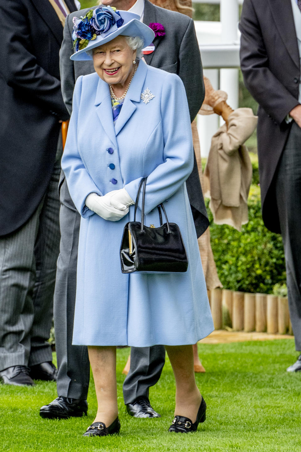 The Queen led the powder blue trend in this ensemble. Photo: Getty