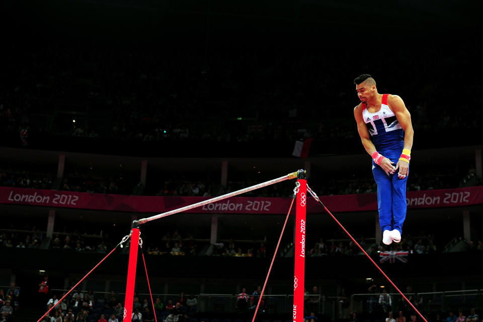 Louis Smith of Great Britain competes in the horizontal bars in the Artistic Gymnastics Men's Team qualification on Day 1 of the London 2012 Olympic Games at North Greenwich Arena on July 28, 2012 in London, England. (Photo by Mike Hewitt/Getty Images)