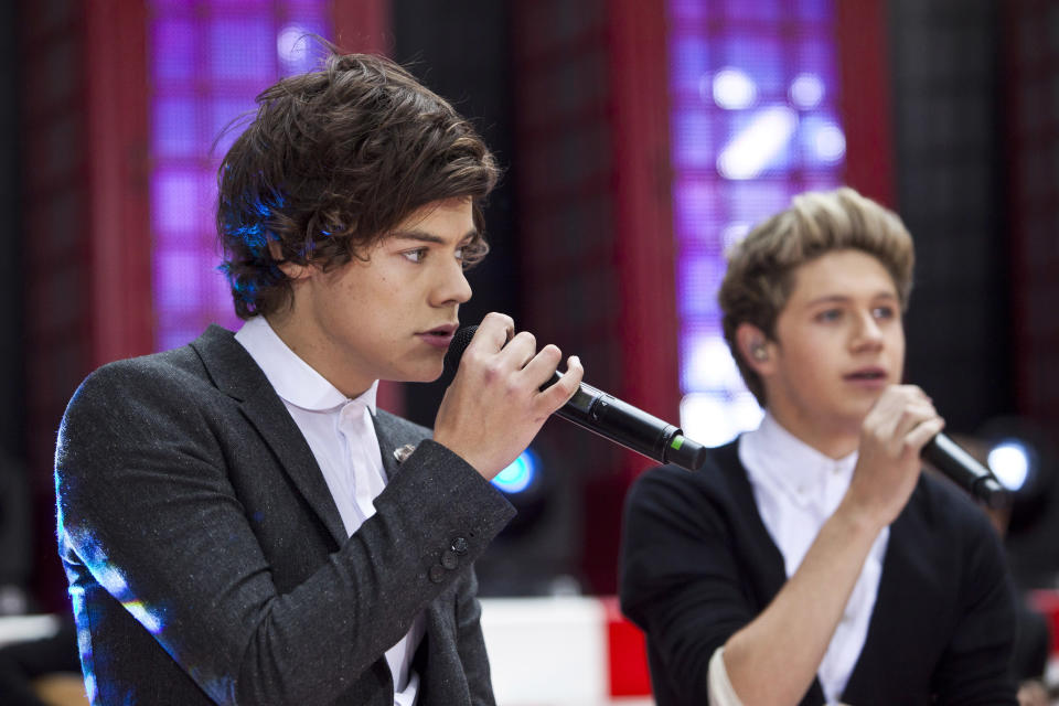 Harry Edward Styles (L) performs with his band "One Direction" on NBC's Today show in New York, November 13, 2012. REUTERS/Andrew Burton (UNITED STATES - Tags: ENTERTAINMENT)