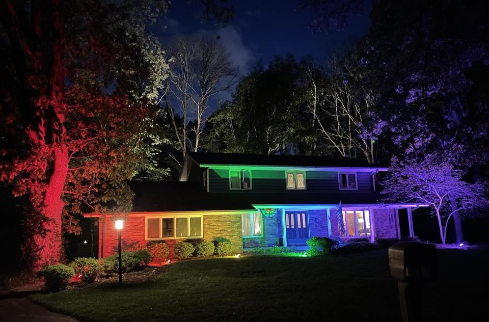 Memo Fachino and Lance Mier lit up the outside of their home in rainbow-colored flood lights to celebrate Pride Month. / Credit: Courtesy of Imgur/Memo Fachino
