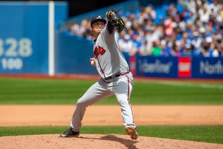 Jun 20, 2018; Toronto, Ontario, CAN; Atlanta Braves relief pitcher Luke Jackson (64) delivers a pitch against Toronto Blue Jays during the eighth inning at Rogers Centre. Mandatory Credit: Kevin Sousa-USA TODAY Sports