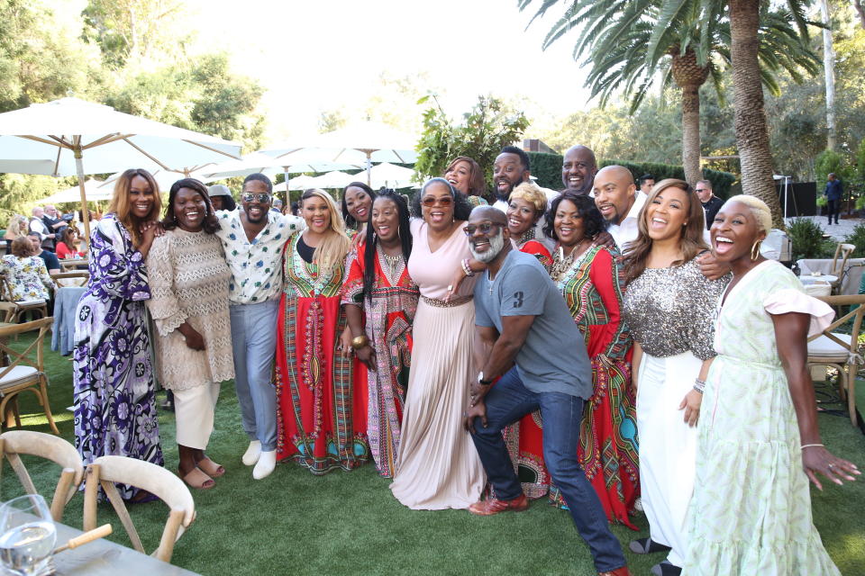 Oprah poses with gospel singers during brunch.