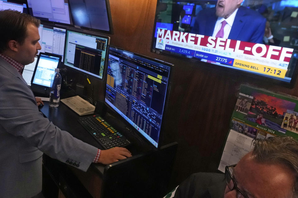 A television screen on the floor of the New York Stock Exchange, Monday, Aug. 5, 2024, headlines trading. Nearly everything on Wall Street is tumbling as fear about a slowing U.S. economy worsens and sets off another sell-off for financial markets around the world. (AP Photo/Richard Drew)