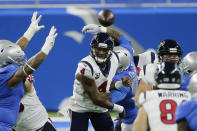 Houston Texans quarterback Deshaun Watson (4) throws under pressure during the first half of an NFL football game against the Detroit Lions, Thursday, Nov. 26, 2020, in Detroit. (AP Photo/Duane Burleson)