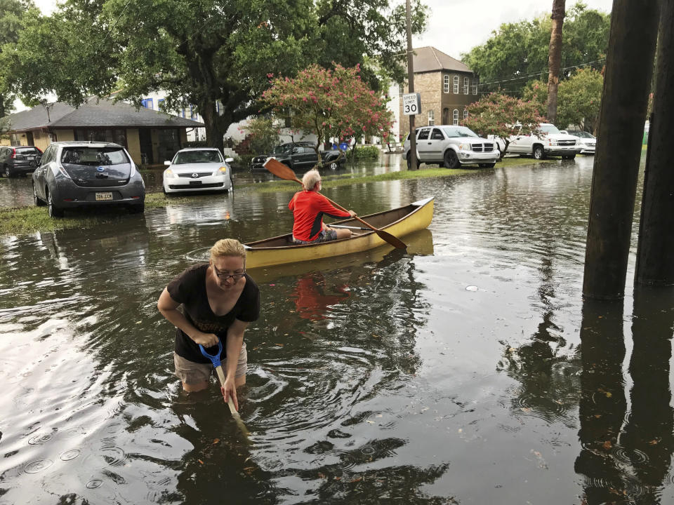 People cope with the aftermath of severe weather in the Broadmoor neighborhood in New Orleans, Wednesday, July 10, 2019. (Nick Reimann/The Advocate via AP)