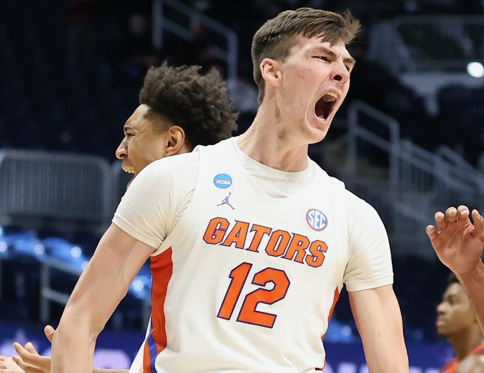 INDIANAPOLIS, INDIANA - MARCH 19: Colin Castleton #12 of the Florida Gators celebrates a basket against the Virginia Tech Hokies in the second half in the first round game of the 2021 NCAA Men's Basketball Tournament at Hinkle Fieldhouse on March 19, 2021 in Indianapolis, Indiana. (Photo by Andy Lyons/Getty Images)