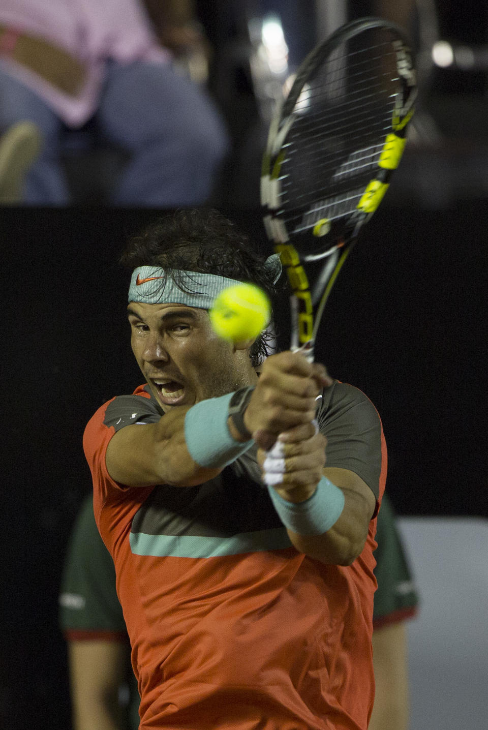 Rafael Nadal, of Spain, returns the ball to Pablo Andujar, of Spain, during a semifinal match at the Rio Open tennis tournament in Rio de Janeiro, Brazil, Saturday, Feb. 22, 2014. (AP Photo/Leo Correa)