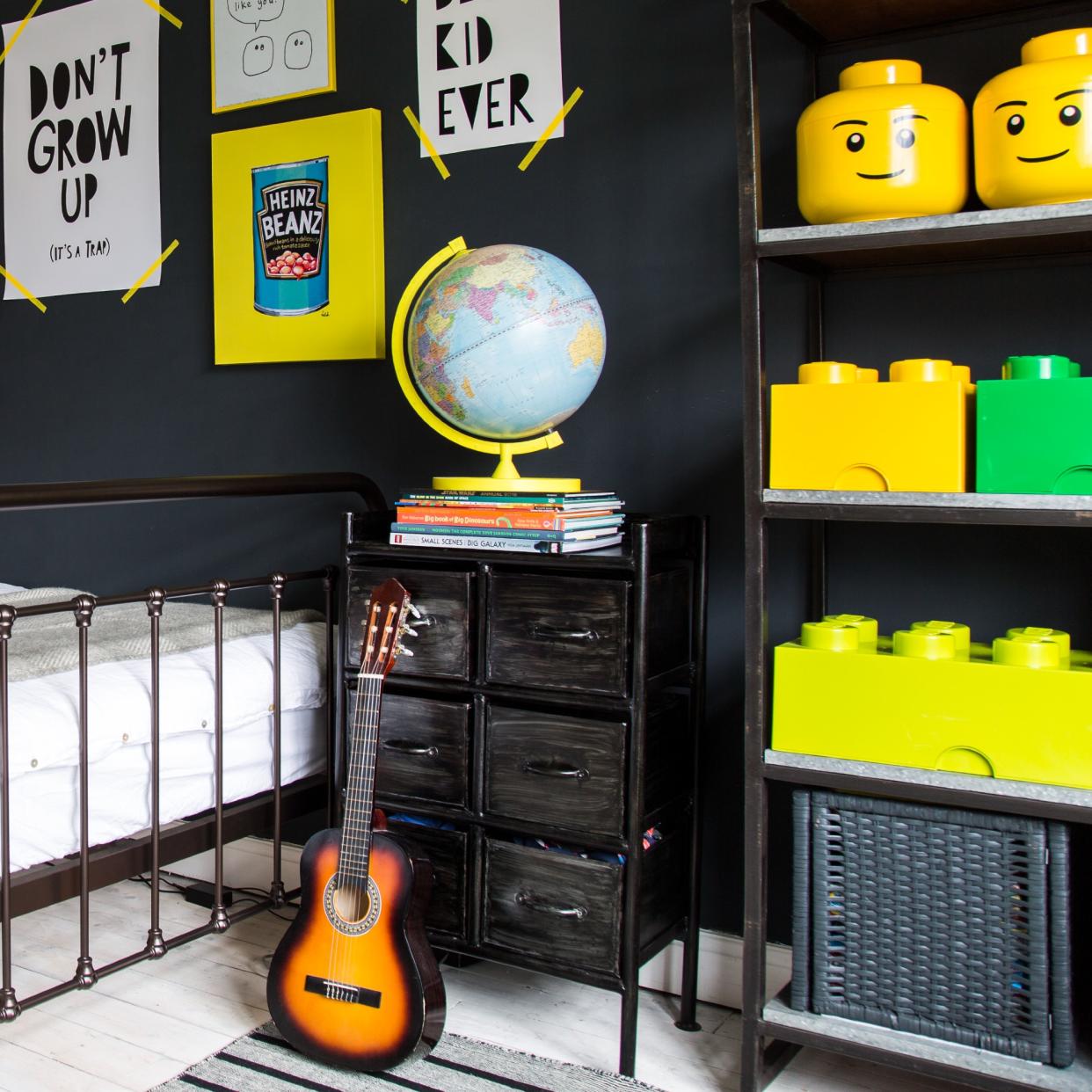  A black-painted kid's room with a Lego display. 