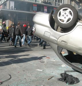 Upside down car and mob