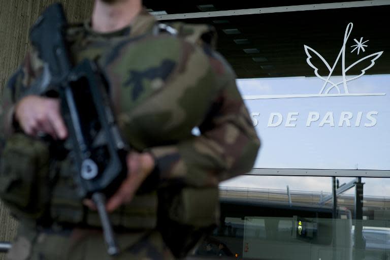 A French soldier patrols at the Charles de Gaulle airport near Paris in the wake of January's Islamist attacks