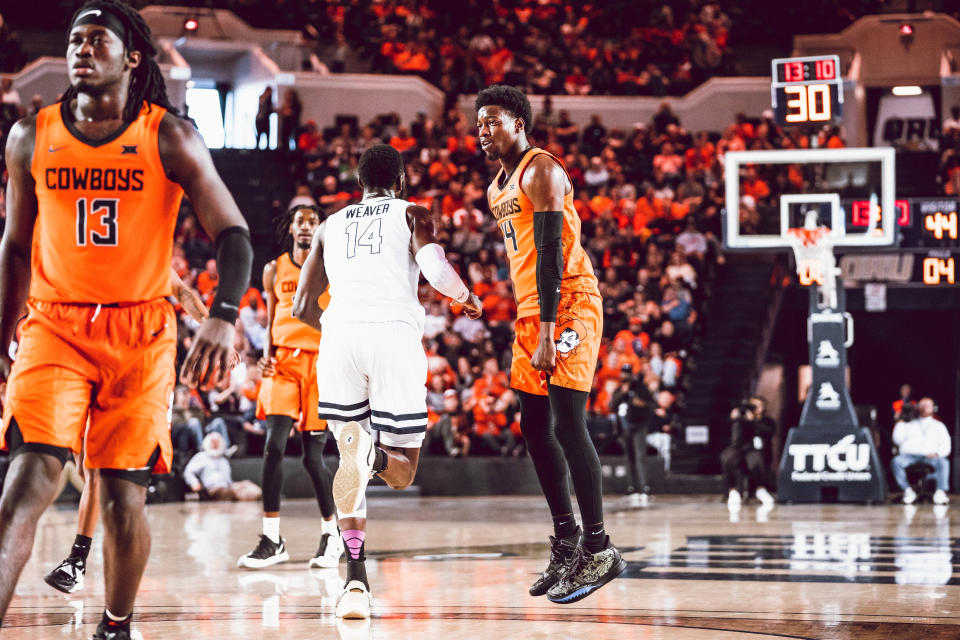 OSU guard Bryce Williams, right, reacts after a play against Oral Roberts in the Cowboys' 78-77 overtime on Friday in Tulsa.