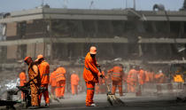 <p>Afghan Municipality workers sweep a road in front of the German Embassy after a suicide attack in Kabul, Afghanistan, Wednesday, May 31, 2017. (AP Photos/Rahmat Gul) </p>