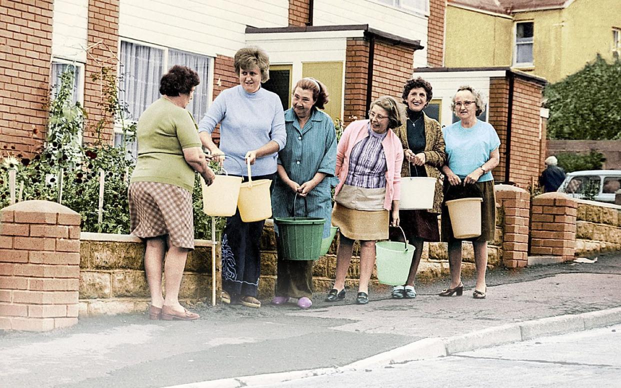 Residents collect their water ration from a standpipe in Devon - John Walters / Daily Mail / Rex Features