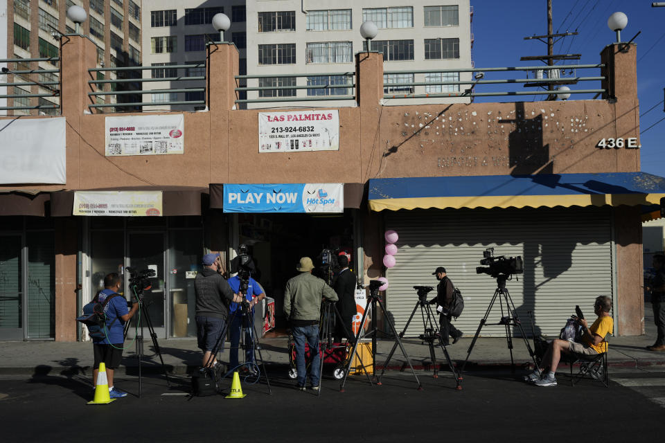 Media gather outside at the Las Palmitas Mini Market where the winning Powerball lottery ticket was sold in downtown Los Angeles, Thursday, July 20, 2023. The winning ticket for the Powerball jackpot is worth an estimated $1.08 billion and is the sixth largest in U.S. history and the third largest in the history of the game. (AP Photo/Marcio Jose Sanchez)