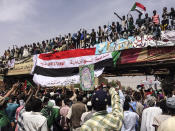 FILE - In this April 12, 2019 file photo, demonstrators chant slogans during a protest in Khartoum. Sudan’s uprising has ushered in a new era both for the nation and for Sudanese women after three decades of autocratic rule by Omar al-Bashir. Sudanese women played a pivotal role in the protests that brought down al-Bashir, and under a joint military-civilian council in power now, they hope for more freedom and equality, and seek to overturn many of the restrictive Islamic laws from the previous era. (AP Photo, File)