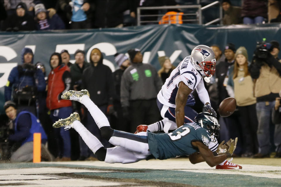 Philadelphia Eagles' Nelson Agholor (13) cannot catch a pass in the end zone against New England Patriots' J.C. Jackson (27) during the second half of an NFL football game, Sunday, Nov. 17, 2019, in Philadelphia. (AP Photo/Michael Perez)