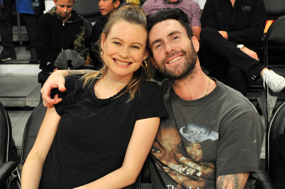 Behati Prinsloo and singer Adam Levine attend a basketball game between the Los Angeles Lakers and the Philadelphia 76ers at Staples Center on November 15, 2017 in Los Angeles, California. (Photo by Allen Berezovsky/Getty Images)