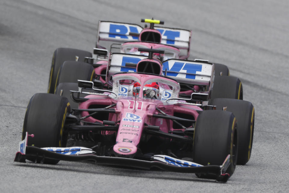 Racing Point's Mexican driver Sergio Perez steers his car in front of Racing Point's Canadian driver Lance Stroll during the Formula One Styrian Grand Prix race on July 12, 2020 in Spielberg, Austria. (Photo by LEONHARD FOEGER / POOL / AFP) (Photo by LEONHARD FOEGER/POOL/AFP via Getty Images)