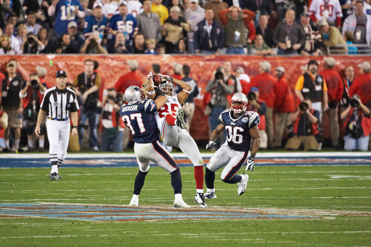 New York Giants David Tyree makes a catch, with the help of his helmet, in the fourth quarter of Super Bowl XLII against the New England Patriots on Feb. 3, 2008.<span class="copyright">John W. McDonough—Sports Illustrated/Getty Images</span>