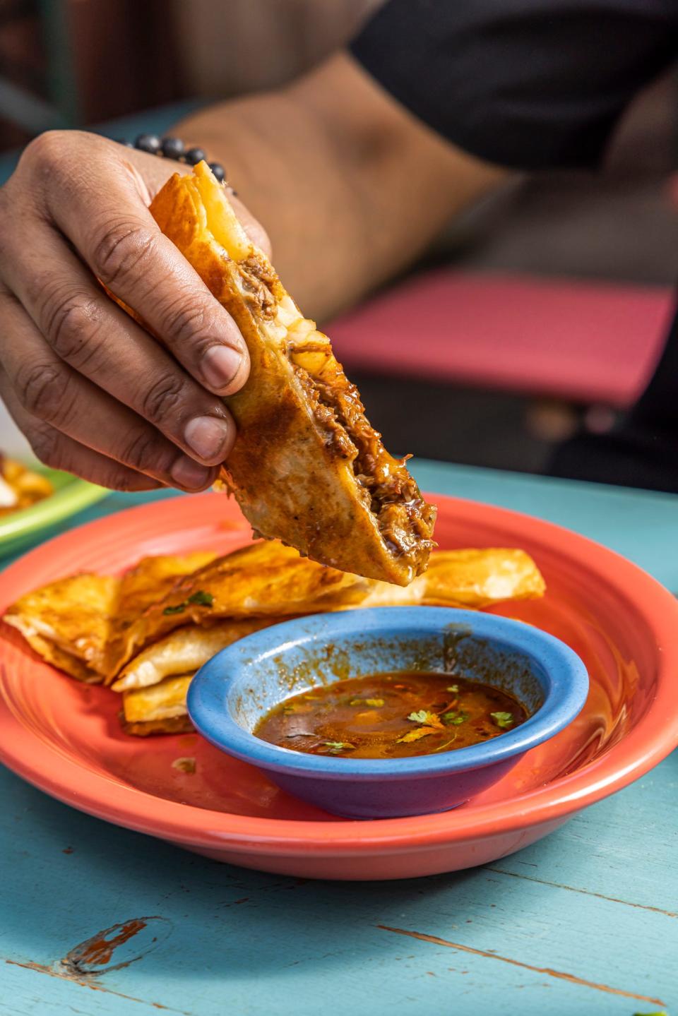 The birria taco is a popular dish on Taco Boy's menu.