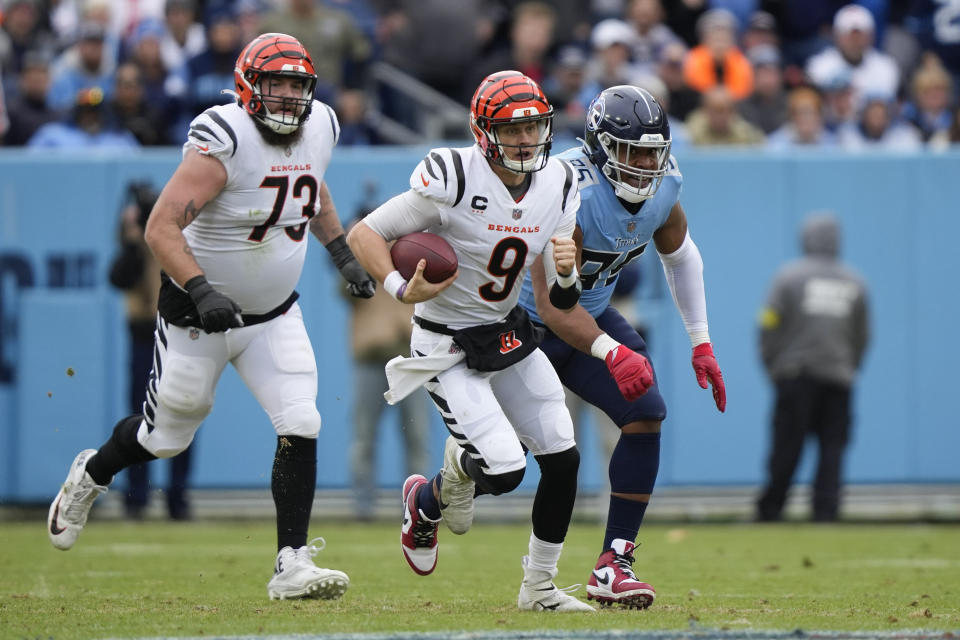 Cincinnati Bengals quarterback Joe Burrow (9) runs out of the pocket against the Tennessee Titansduring the first half of an NFL football game, Sunday, Nov. 27, 2022, in Nashville, Tenn. (AP Photo/Gerald Herbert)