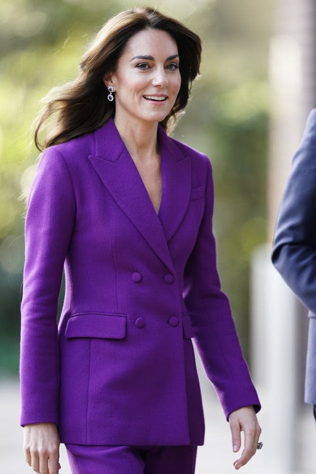 Kate, in a striking purple suit, arriving at the Shaping Us National Symposium in London